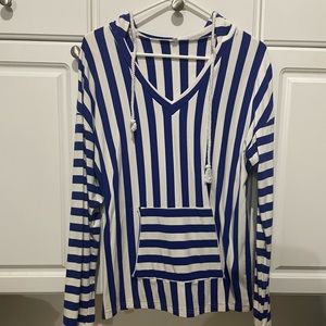 Women’s medium long sleeve hoodie with pocket in front and rope for strings.